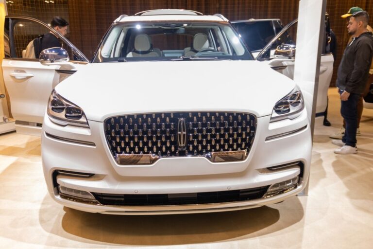 Front view of an elegant white Lincoln Corsair in display at the 2022 New York Auto Show.