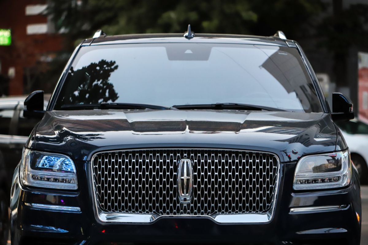 Front view angle of a Lincoln Navigator in a black colorway captured parking at the street of Kyiv Ukraine.