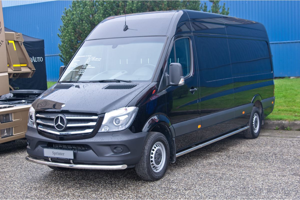 Black Mercedes Sprinter Van at a set for filming movies.