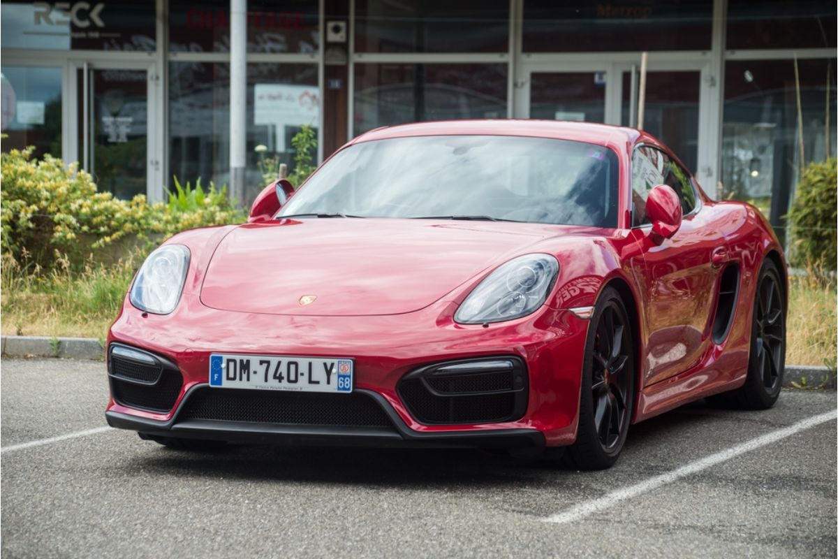 Front angle of the brand new 2022 model Porsche 911 GT3 in red colorway spotted parking outdoors in France.