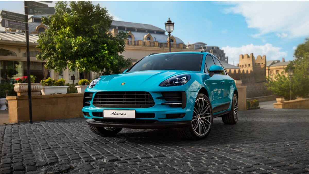 Luxurious Porsche Macan in a skyblue colorway spotted parking outdoors at the street in Baku Azerbaijan.