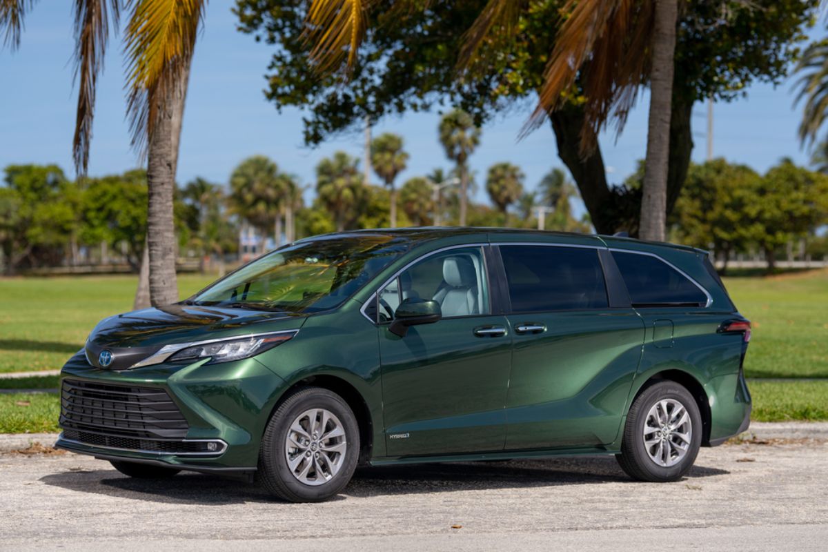 Dark green Toyota SIenna parked at the sunny streets of Miami, Florida.