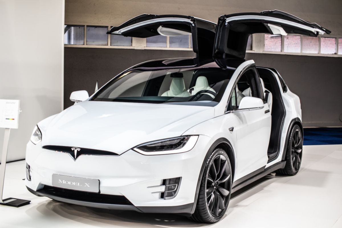 Metallic white Tesla Model X being showcased at Brussel motor show in 2019.