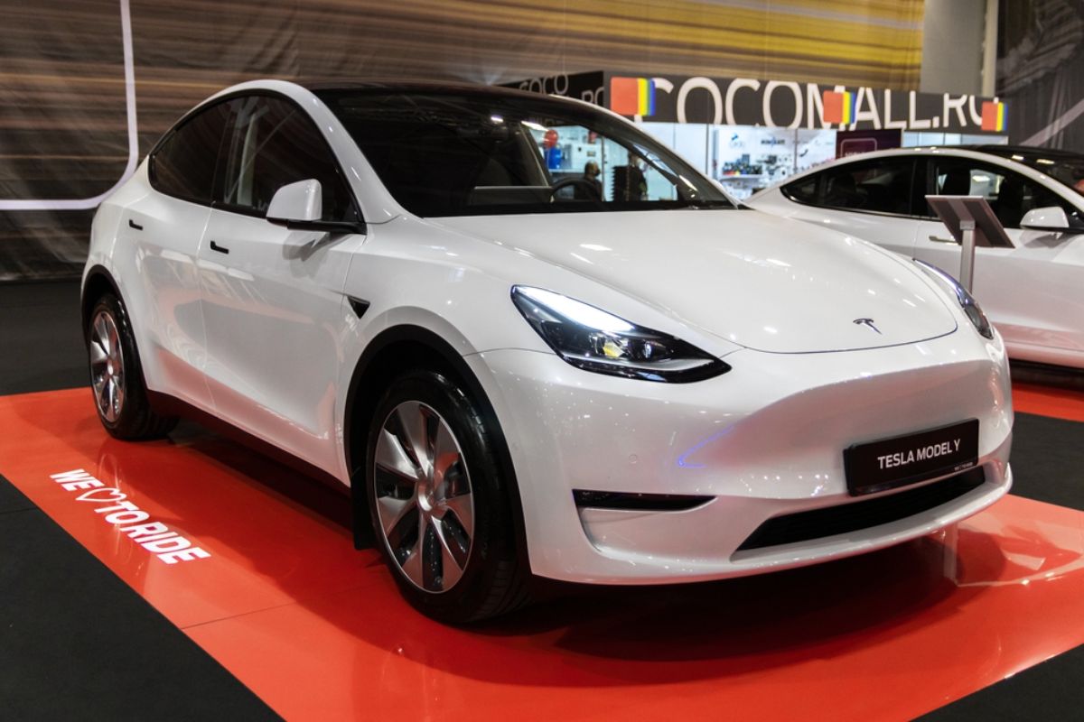 Brand new Tesla Model Y in white colorway in display at a auto dealership store in Bucharest Romania.