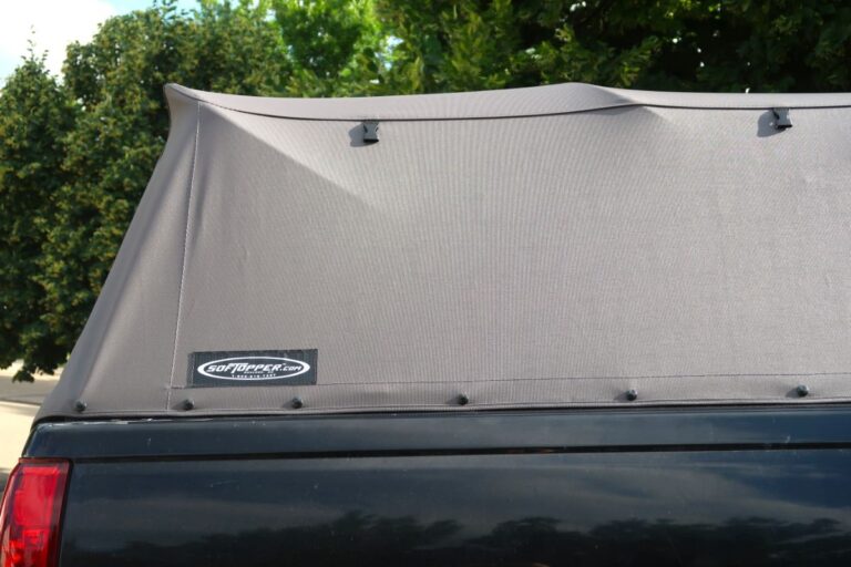 A softopper brand folding fabric pickup truck bed cover cap.