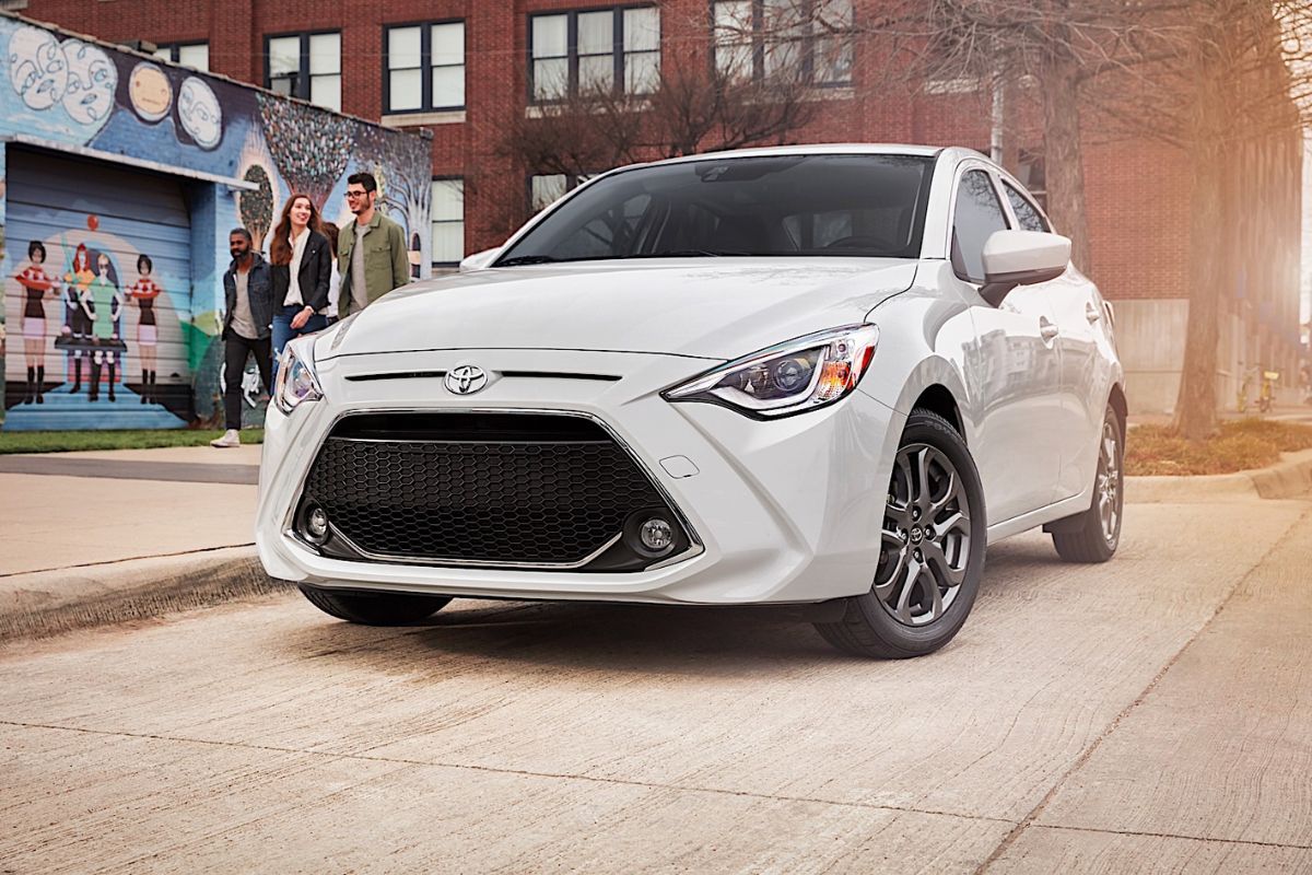 Brand new Toyota Yaris iA 2019 model in a white colorway parked at the street.