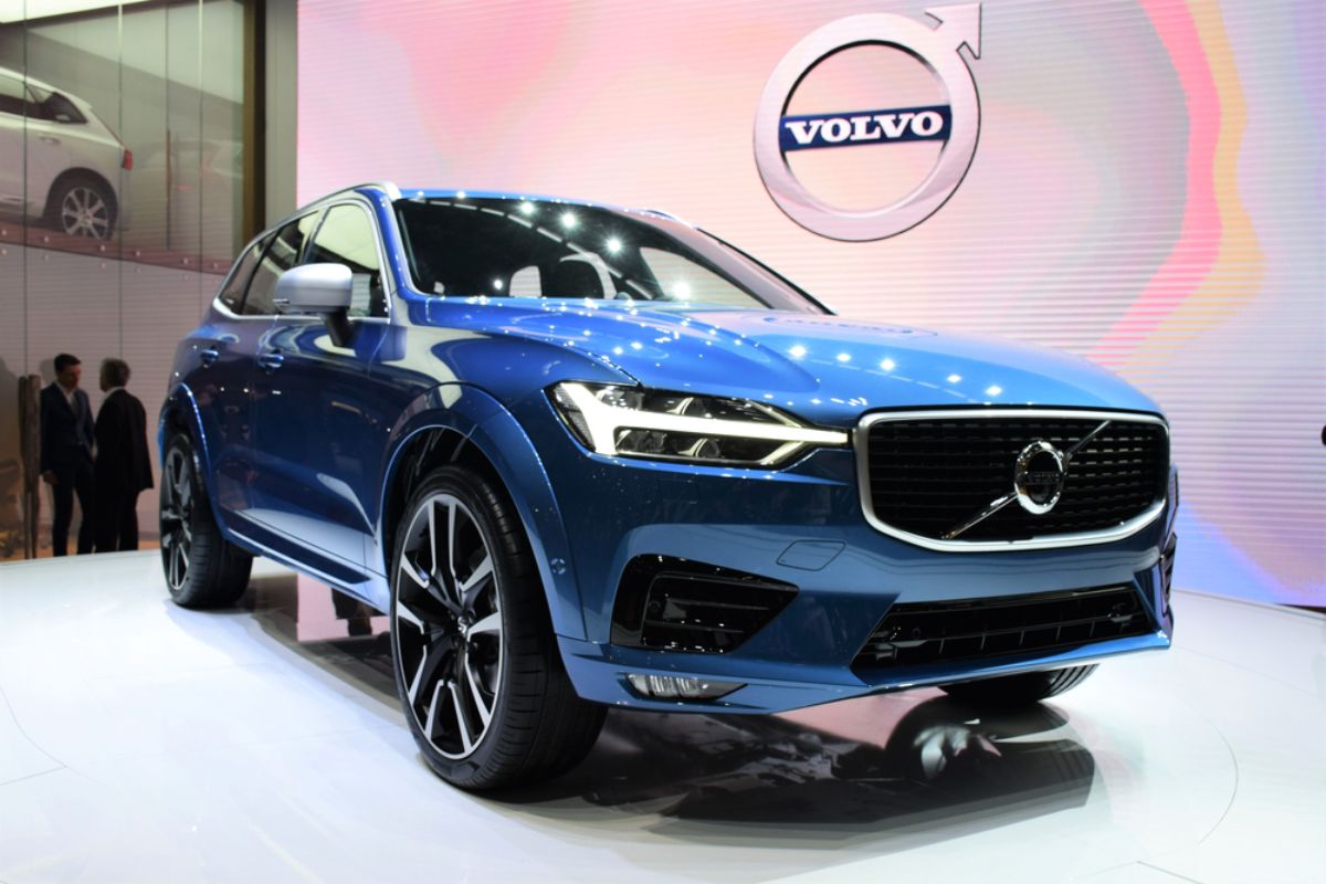 Front side view angle of a brand new Volvo XC60 in metallic blue colorway in display at the Geneva International Auto Show.