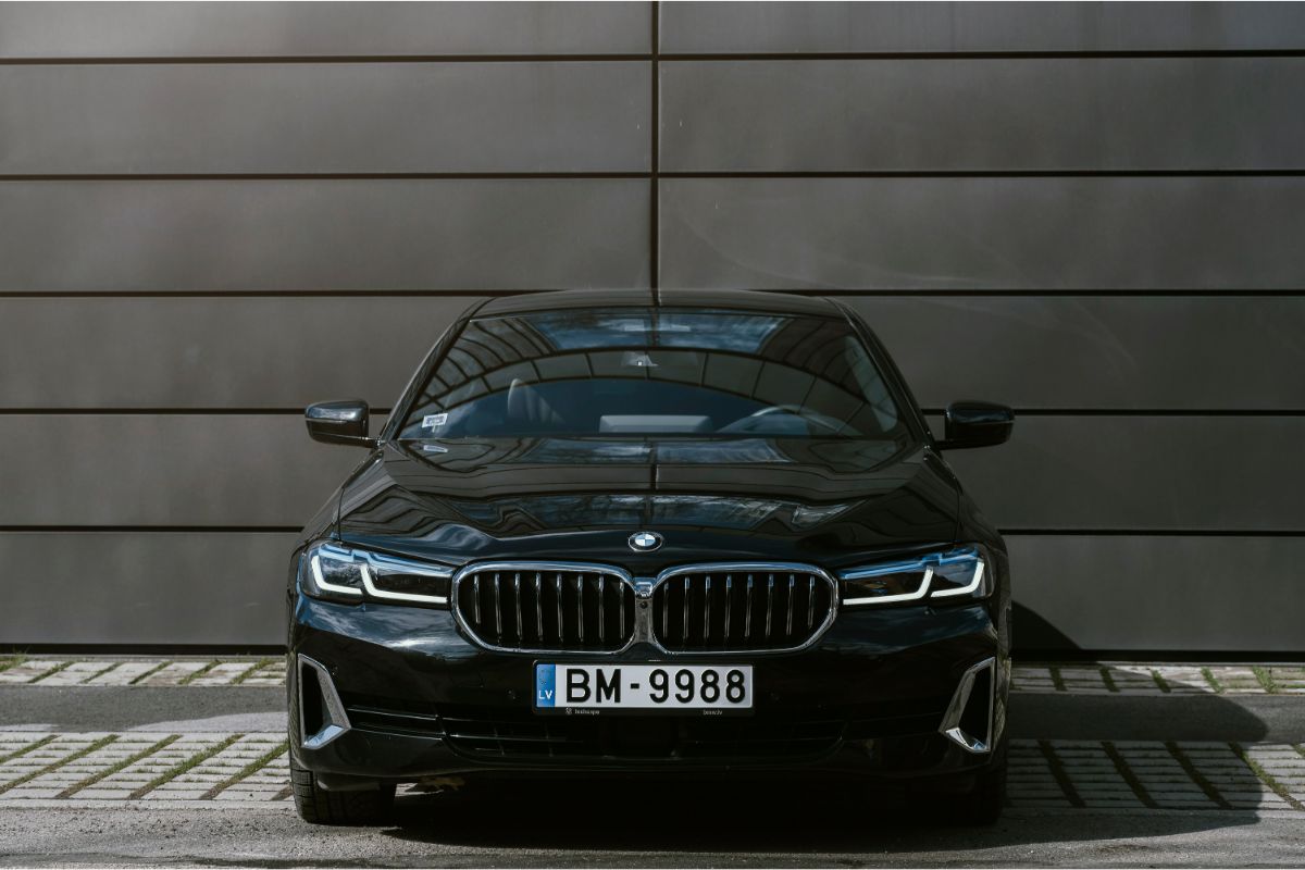 Fron view of 2022 BMW 5 Series in a black color parked at the parking space.