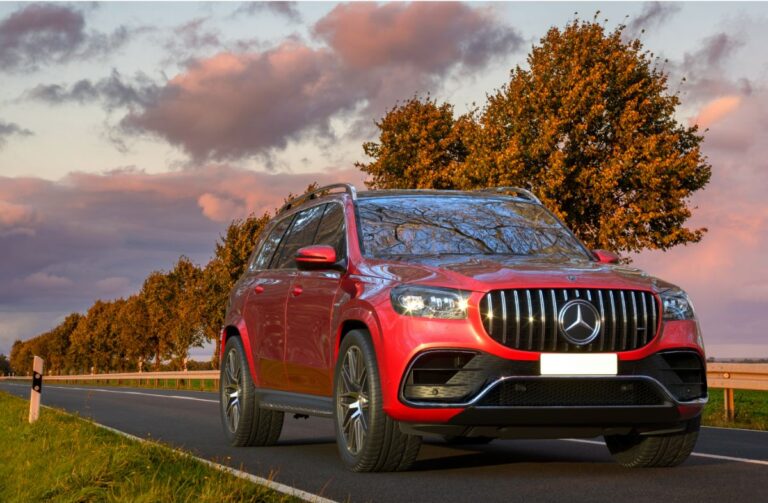 2022 model of the all new elegant and classy Mercedes GLS in metallic red colorway with beautiful sky in the background.