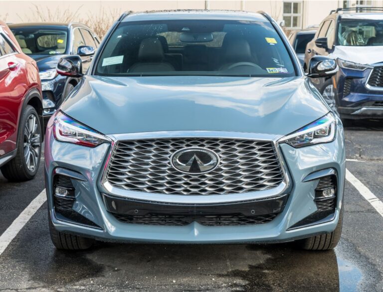 Front view of a shiny Infiniti QX55 parked in the parking lot.