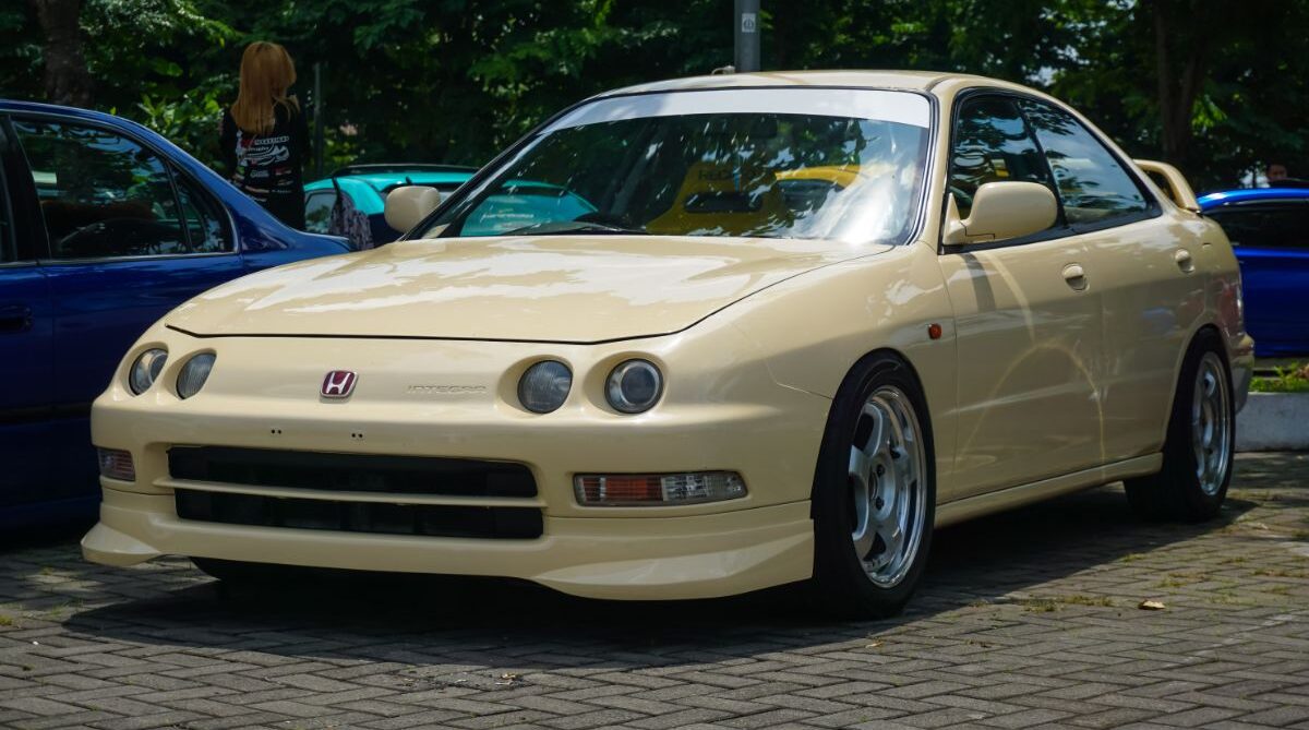 Front view shot of a glossy Acura Integra parked.