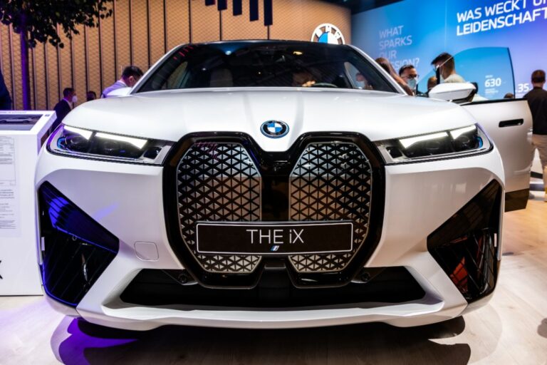 Close up front side view of a brand new BMW IX displayed at an SUV Carshow.