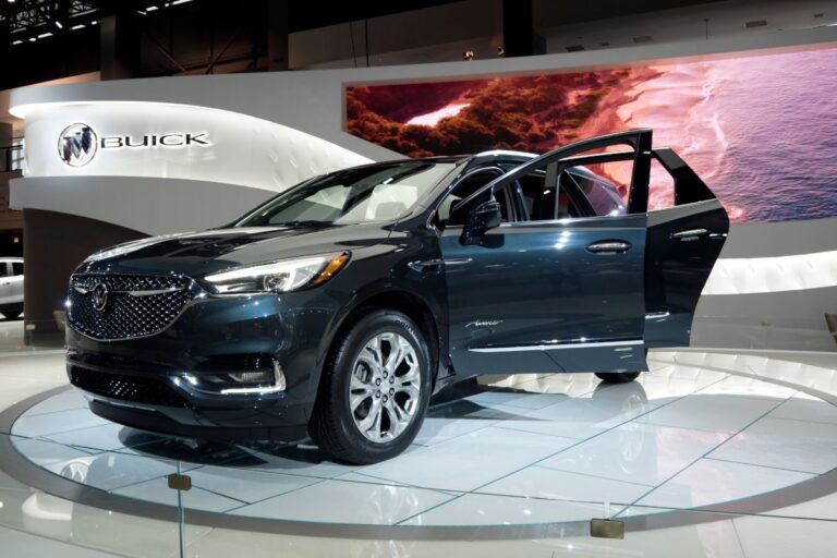 Buick Enclave Avenir at the annual International auto-show with left side doors open.