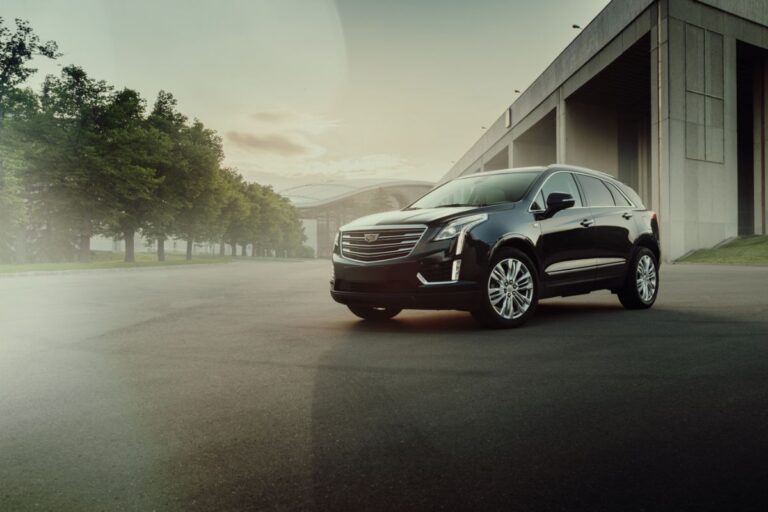 A beautiful shot of cadillac xt5 in a black color side view.