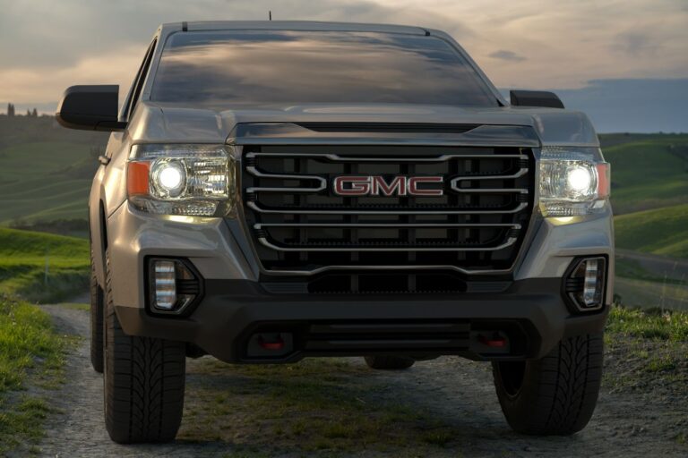 Front angle of a brand new GMC Canyon with beautiful sunset background.