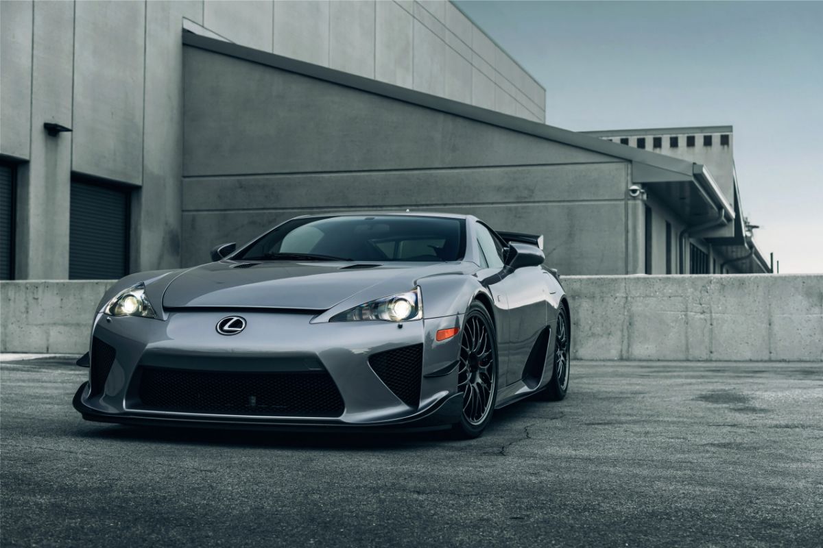 A good looking photo of Lexus ES in a grey color at the grey background surroundings.