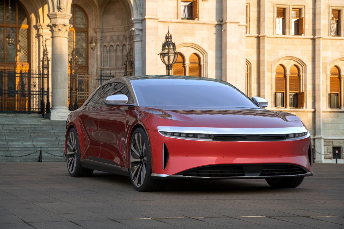 Front view look of Lucid Air car in a red color parked outside.