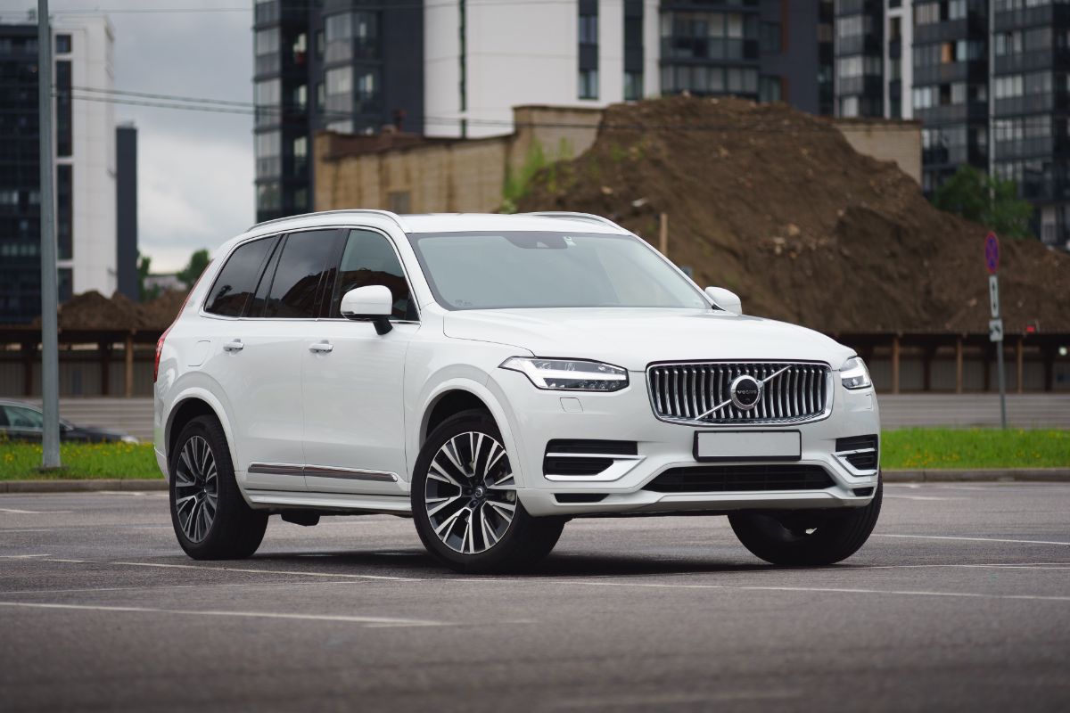 White 2022 Volvo XC90 on road.