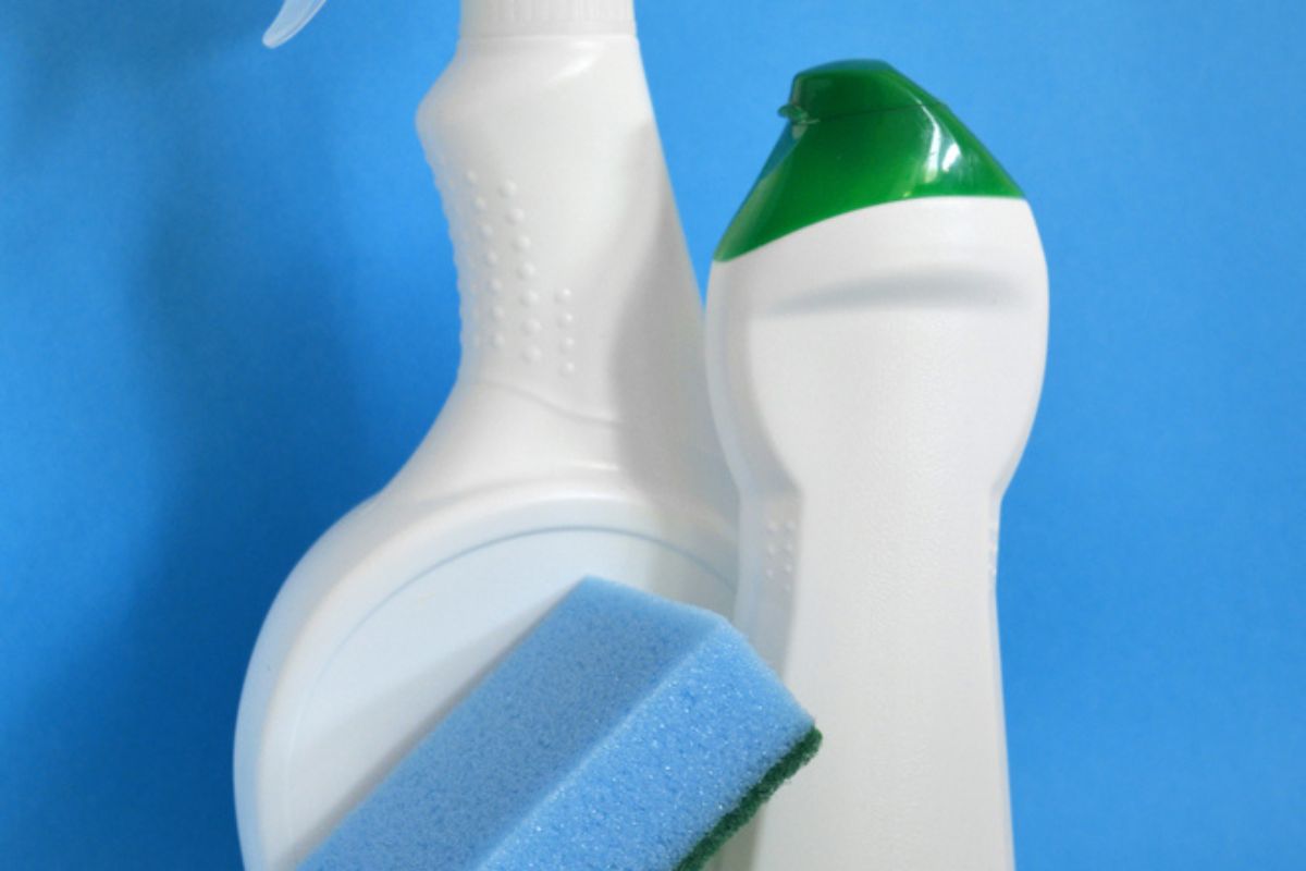 Cropped image of a chlorox and sponge - a cleaning materials.