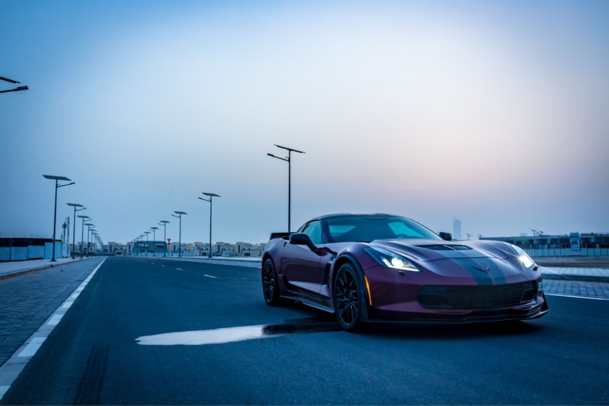 The Chevrolet Corvette Z06 sports car on an empty road at dawn.