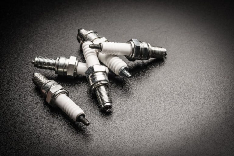 Spark plugs on black background.