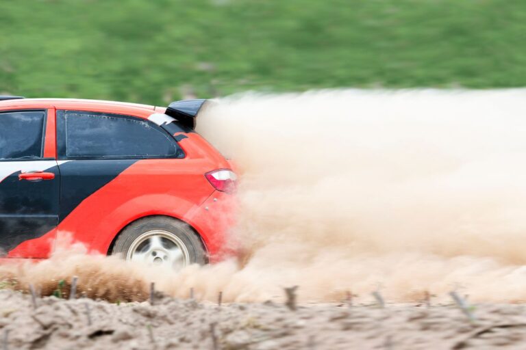 Rally car in dirt track.