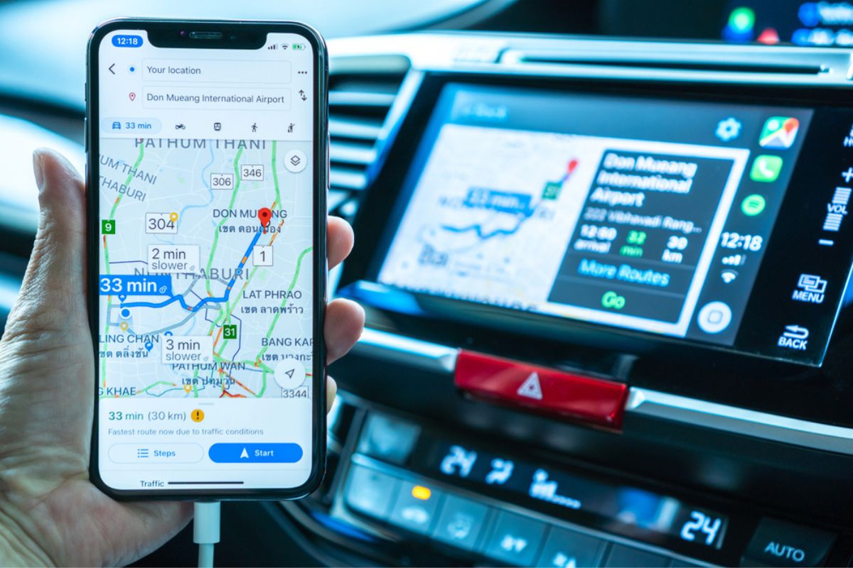 Google map on Apple CarPlay app on iPhone X smart mobile application connected to Honda car for online gps road travel map, transportation vehicle safety.