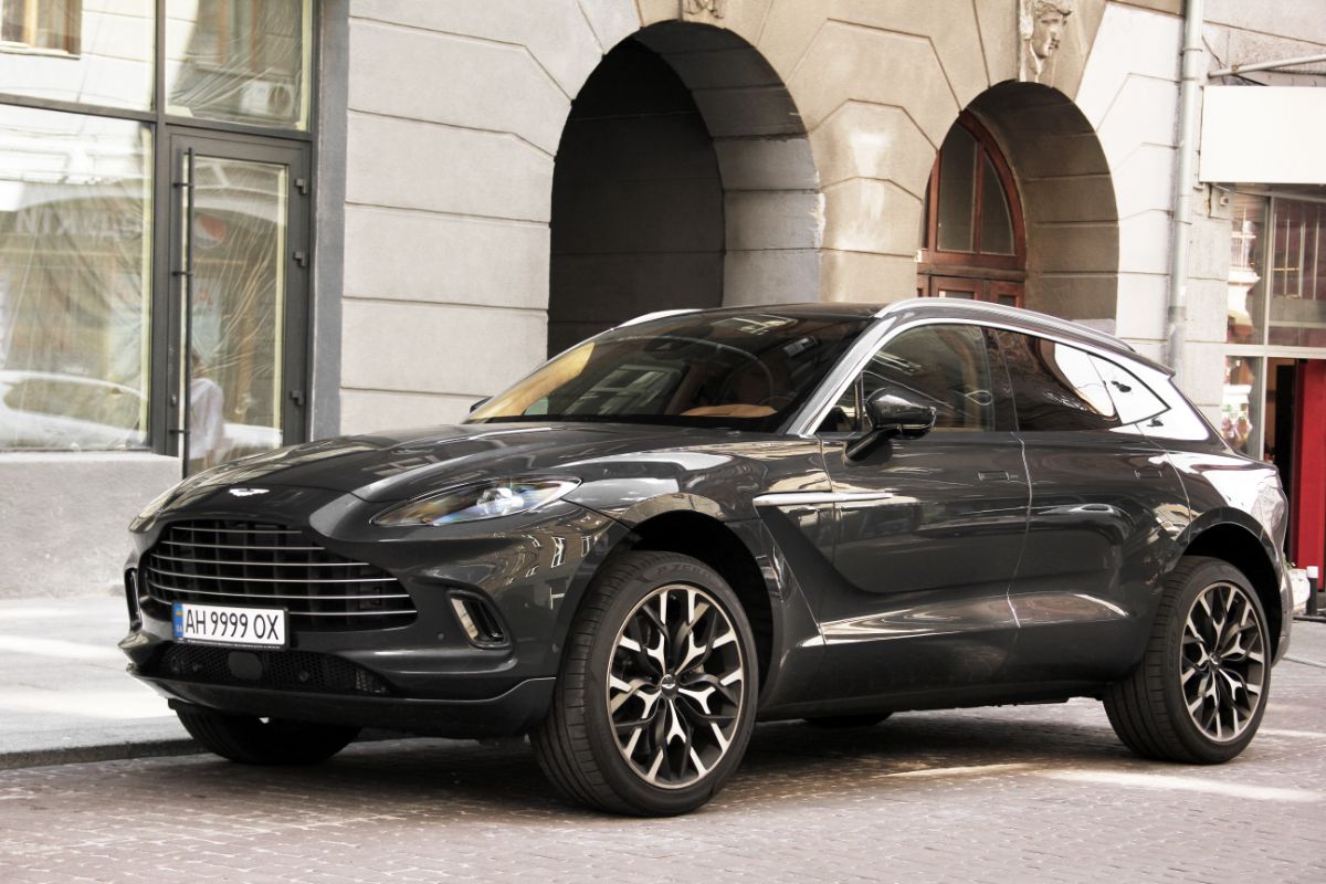 Gray luxury super SUV from Aston Martin, luxury British SUV in the metropolis.