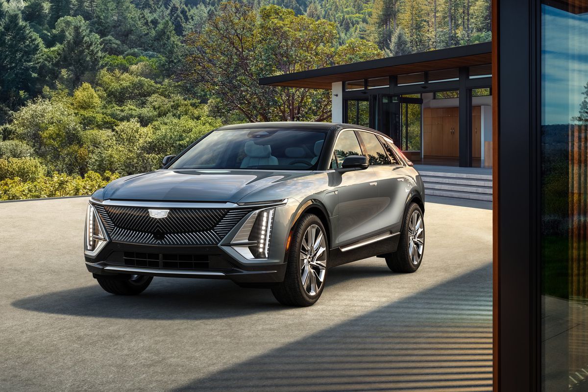 A photo of Cadillac Lyriq EV car displayed outside the house.