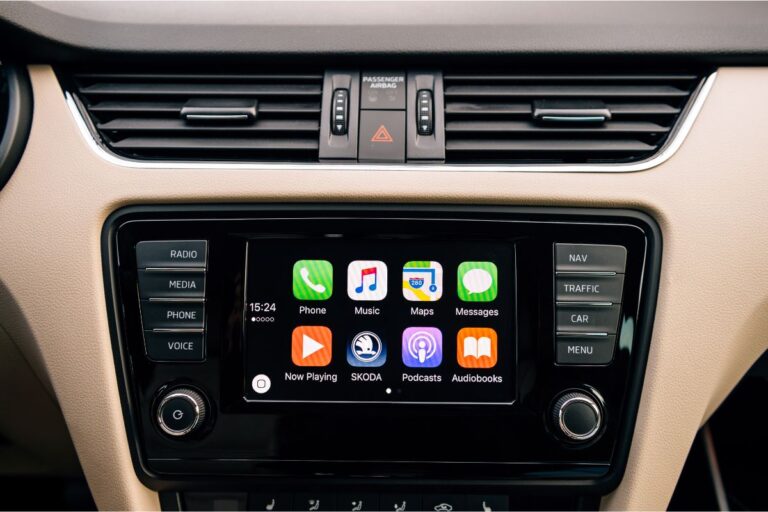 An apple car play mmainscreen with apps in a vehicle.