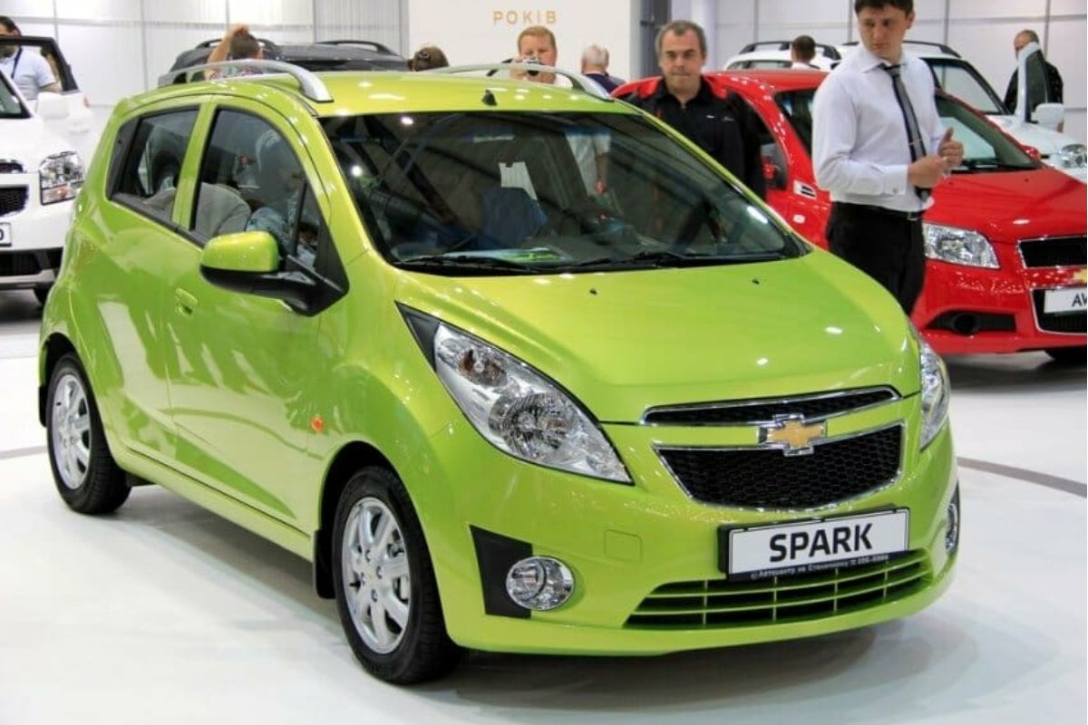 A brand new Chevy Spark economy car in yellow green colorway.