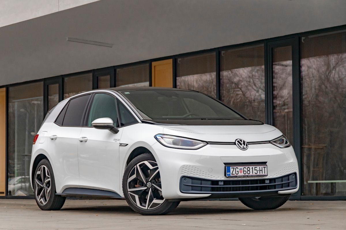 A white Volkswagen compact car spotted parking outdoors.