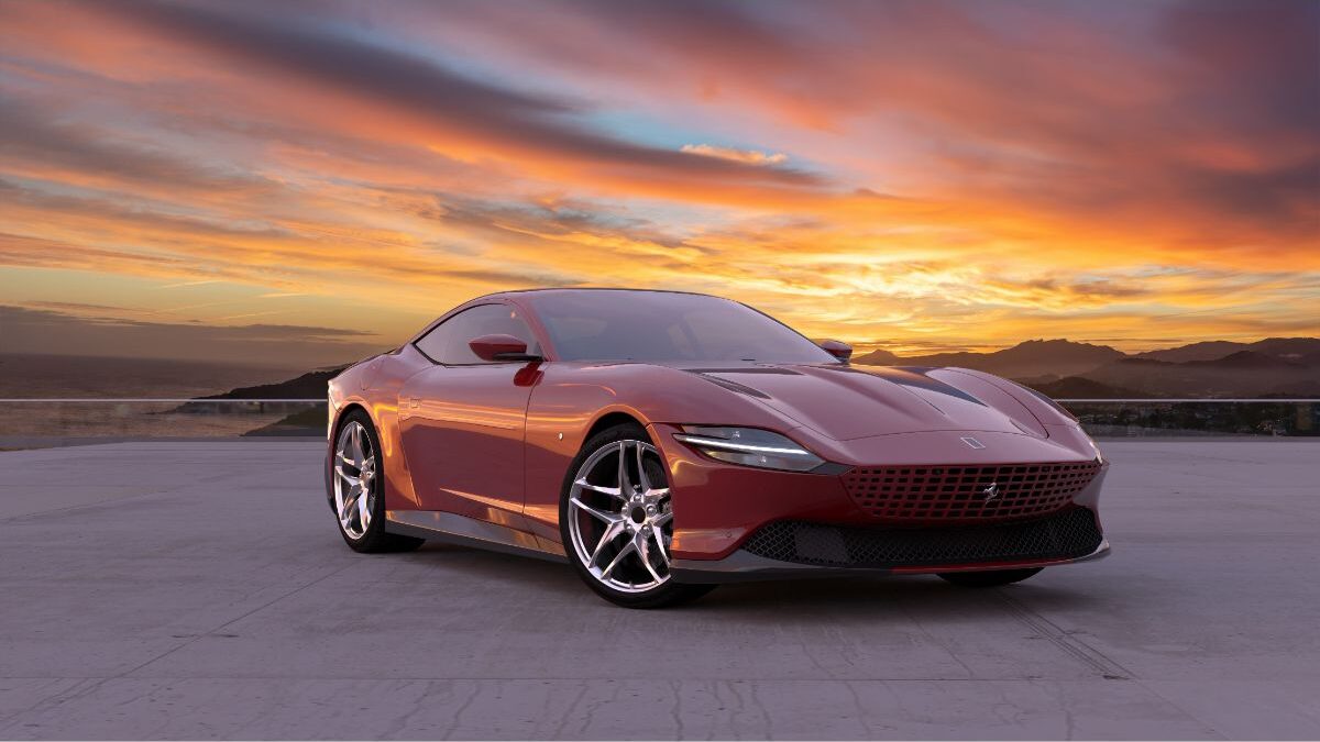 Elegant style of a maroon Ferrari Roma on a plain hard ground at sunset.