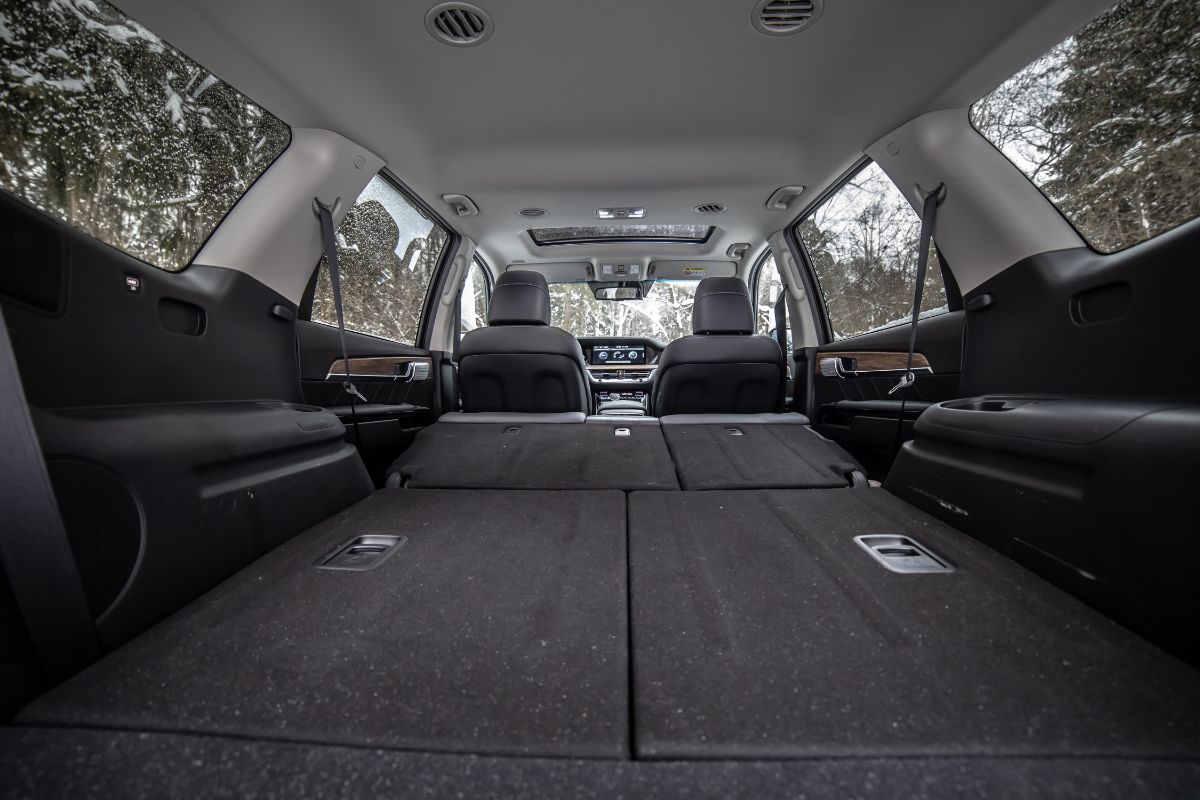 The second and third rows of seats within an SUV are folded.