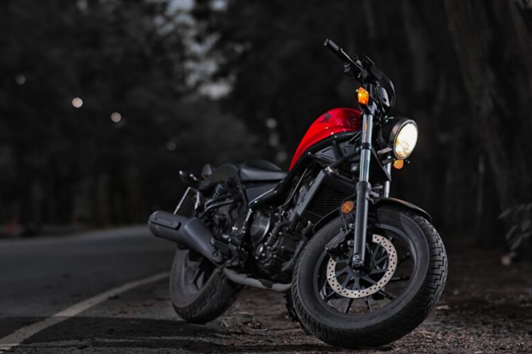 A vintage Honda Rebel 300cc in red and black colorway.