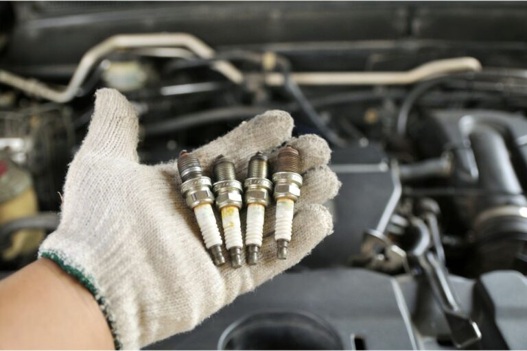 By way of a maintenance schedule, dirty hands brought the old spark plugs to be replaced.