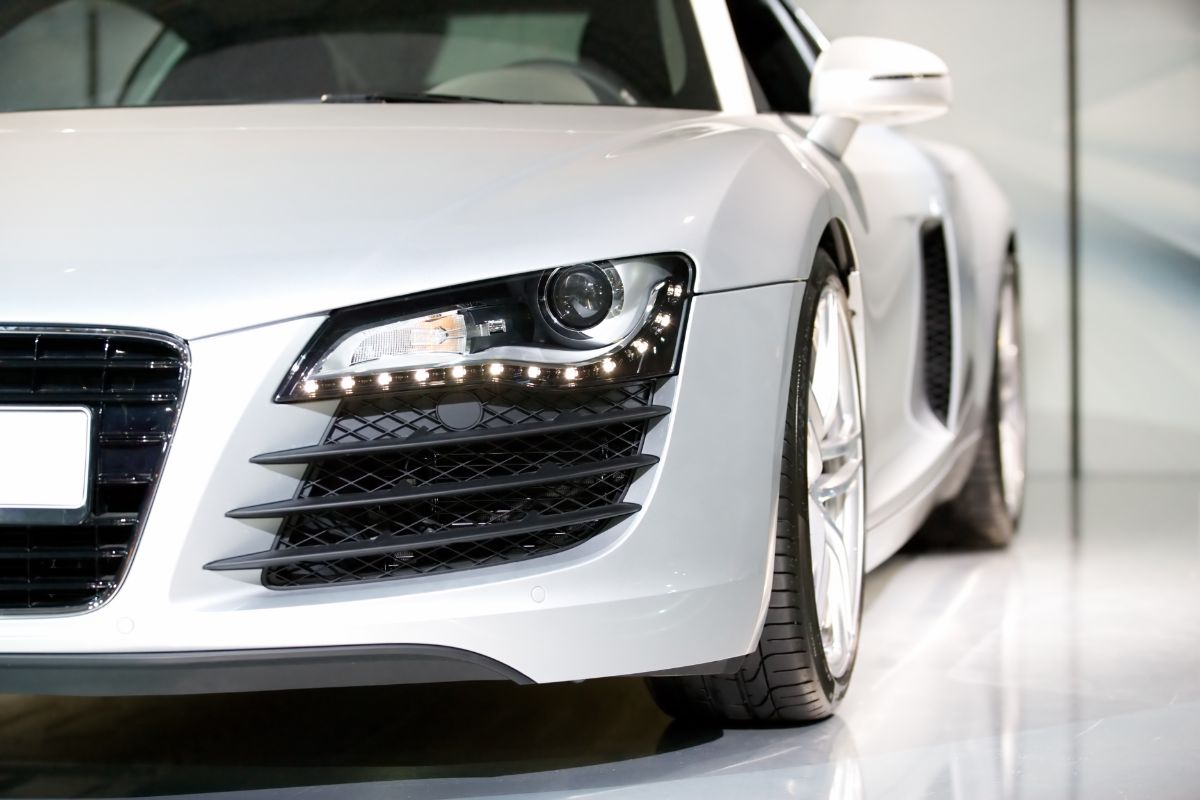 Close up shot of white sports car at the auto show.