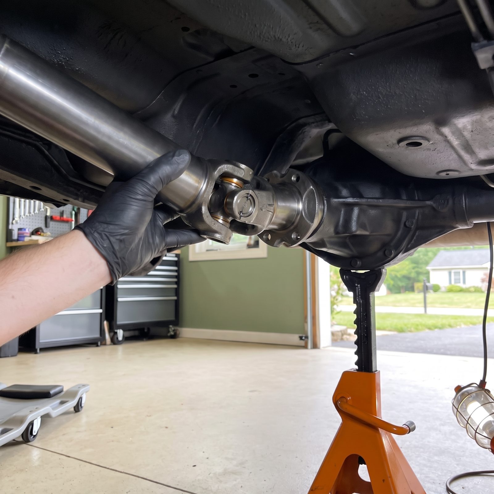 Check Driveshaft U-Joints for Play and Axle Seals for Leaks