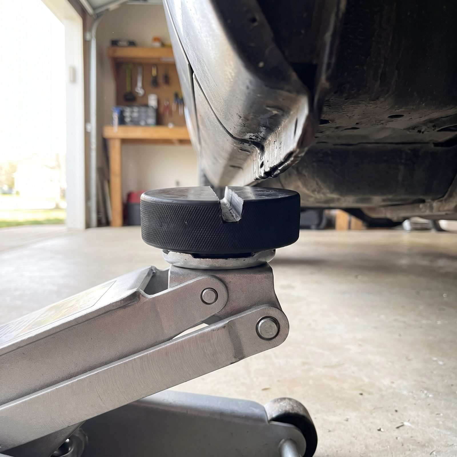 Cut a Slot in a Hockey Puck to Make a Pinch-Weld Jack Pad