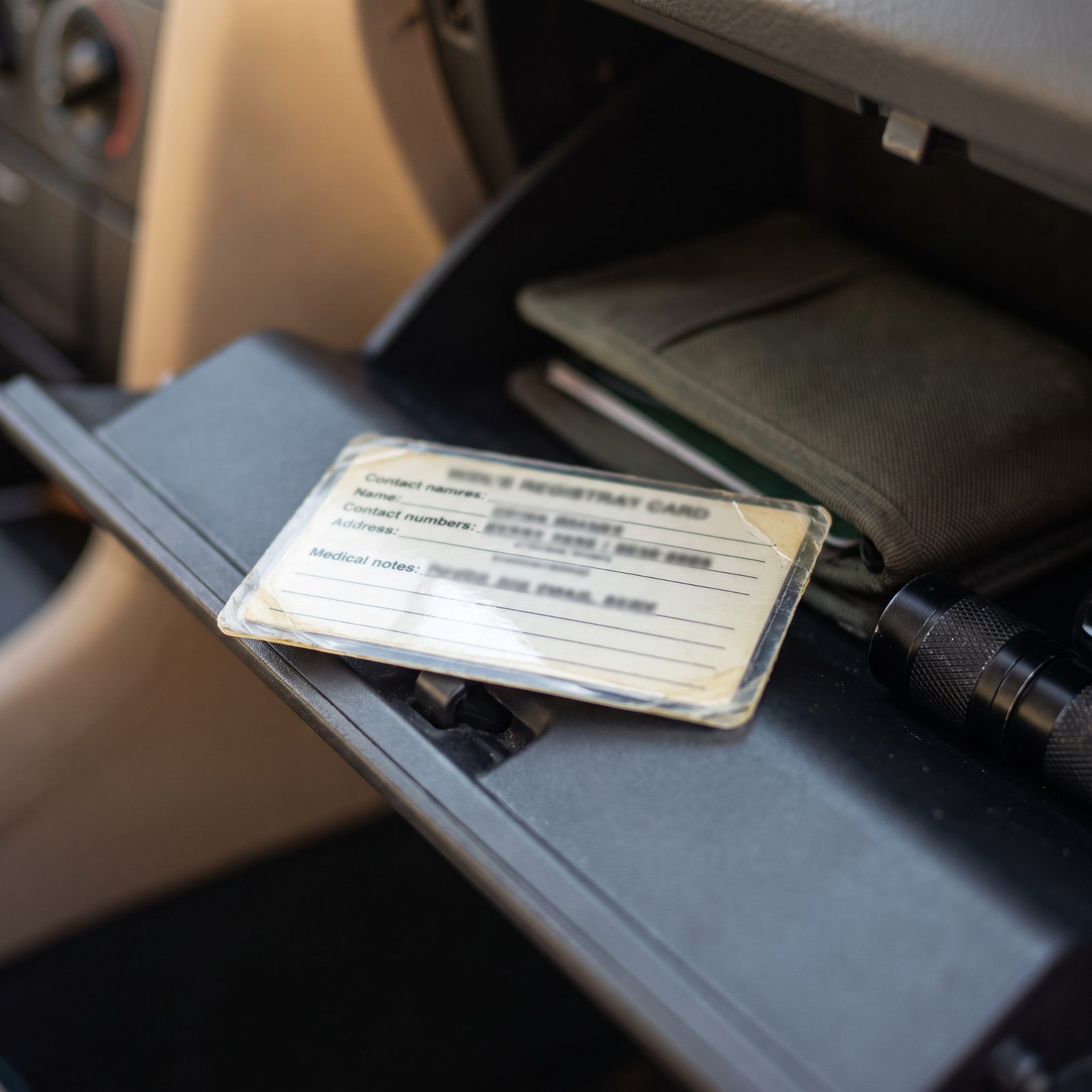 A Laminated Emergency Contact and Medical Card in the Glovebox