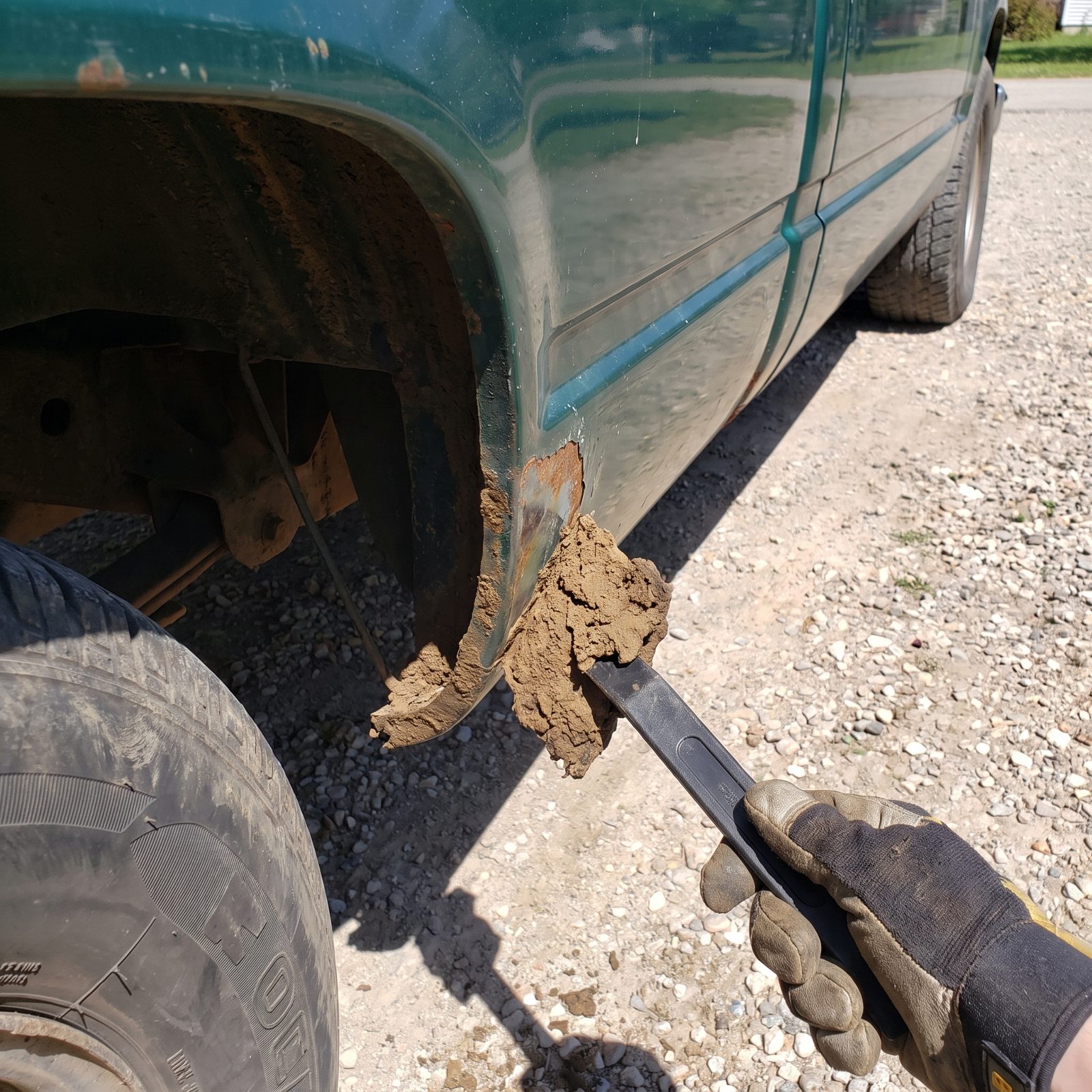 Remove Packed Mud From Wheel-Well Lips Before It Holds Moisture