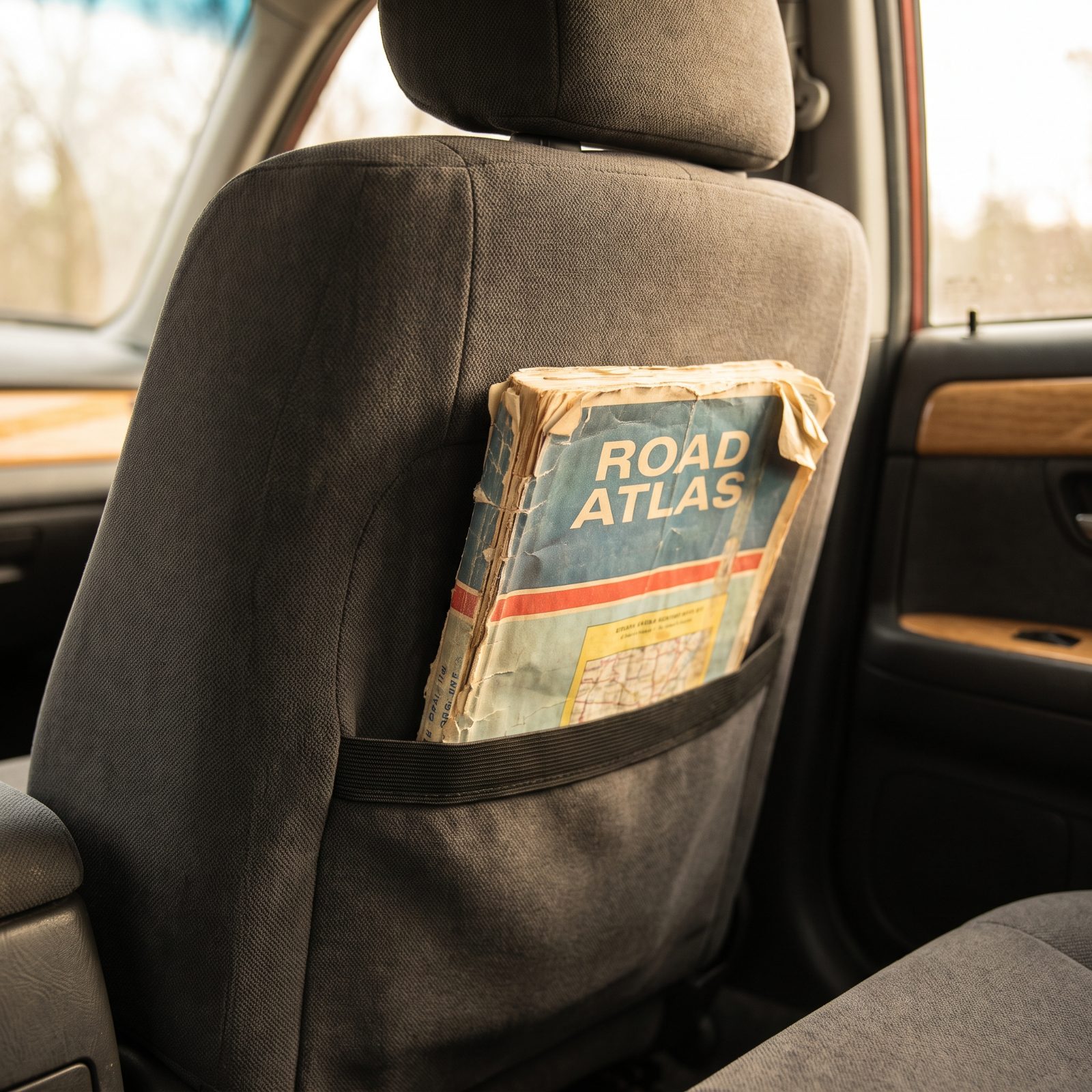A Road Atlas in the Seat-Back Pocket