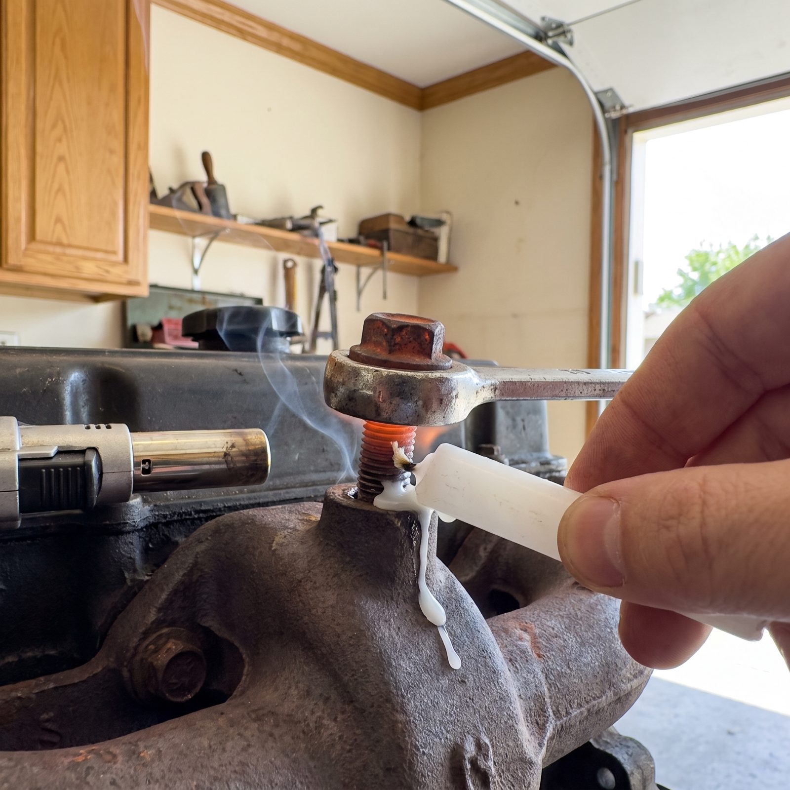 Touch Candle Wax to Heated Threads on a Seized Fastener